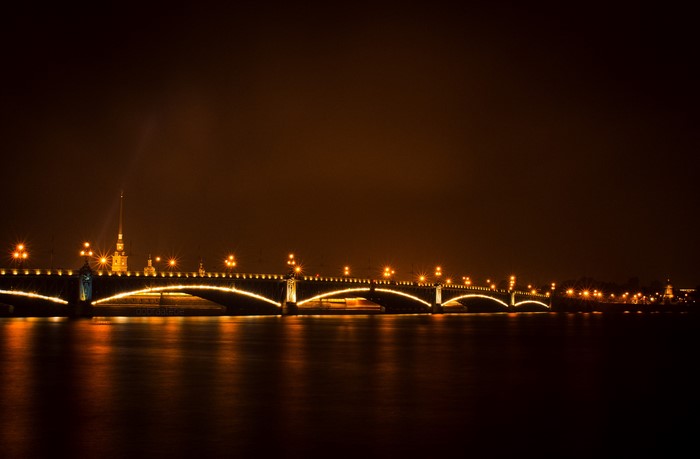 Bridge over river at night in St. Petersburg, Russia