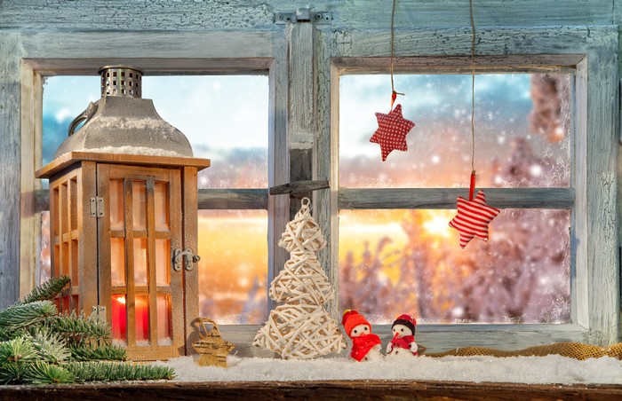 Christmas window with lantern and snowmen
