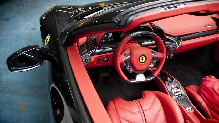 Ferrari convertible interior with red leather seats