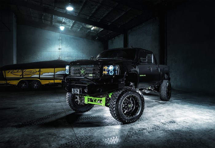 Black GMC Sierra Denali pickup truck with trailer