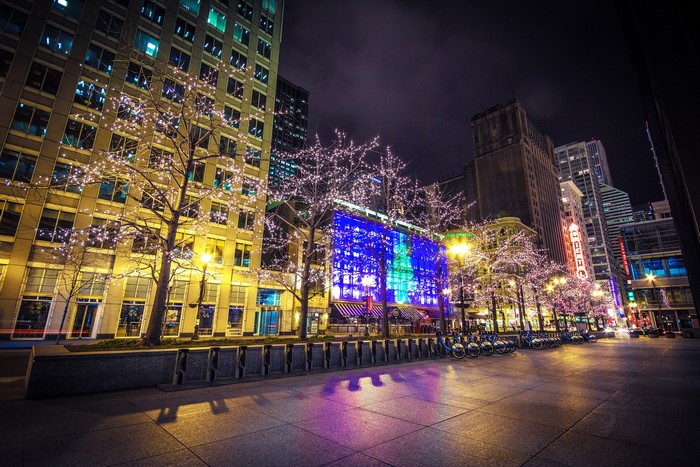 Chicago street at night with fairy lights and bicycles