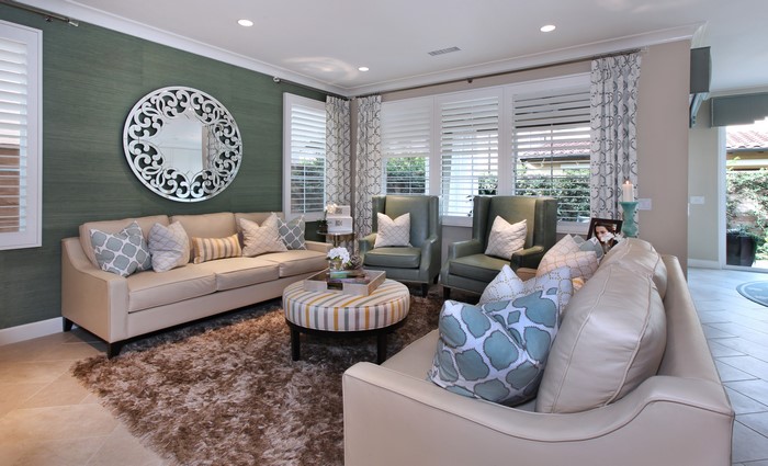 Living room with sofa, armchairs, and ottoman
