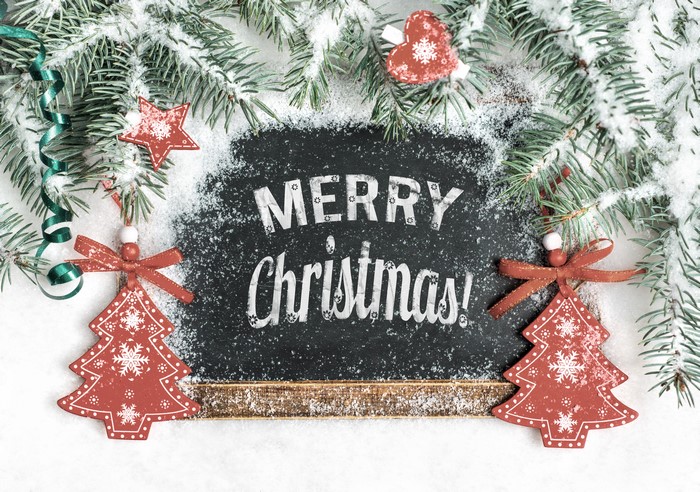 Merry Christmas chalkboard with pine branches and ornaments