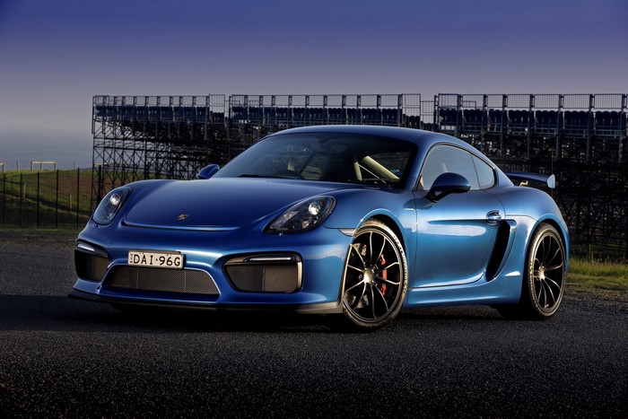 Blue Porsche Cayman GT4 on a Race Track