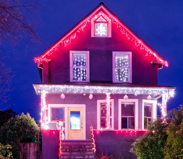 House decorated with Christmas lights at night