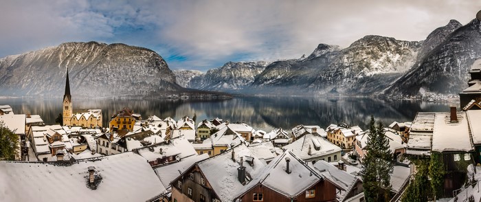 Hallstatt village with snow-covered roofs and mountains