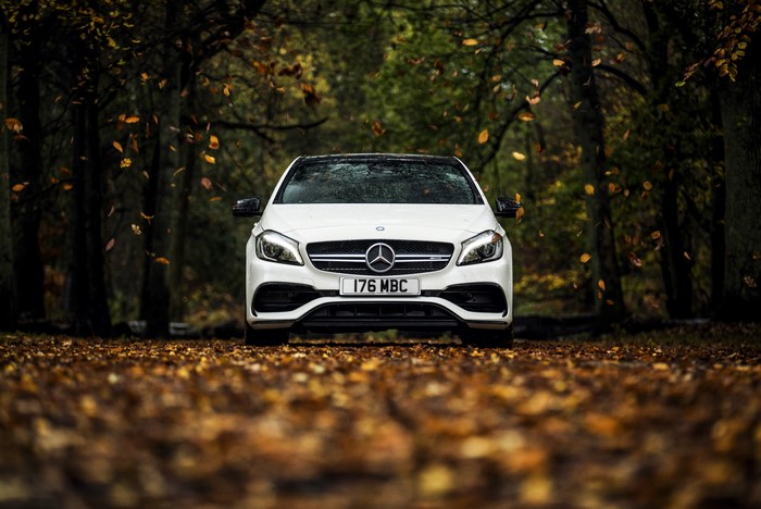 White Mercedes-Benz AMG A-Class W176 in Autumn Forest