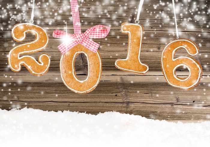 Gingerbread numbers 2016 with snow and wooden background