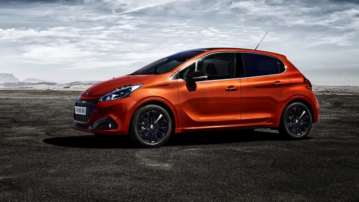 Orange Peugeot 208 5-door car