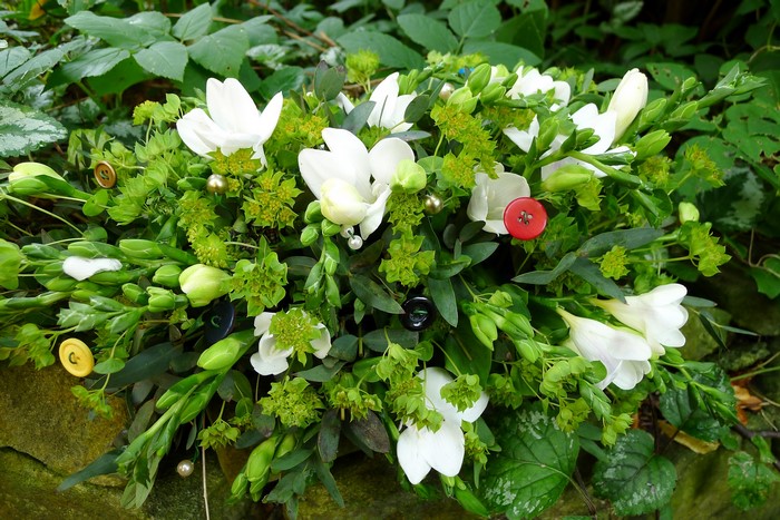 White Freesia flowers with buttons and pearls