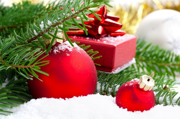 Christmas ornaments and gift with snow