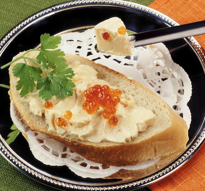Bread with butter and caviar on a plate