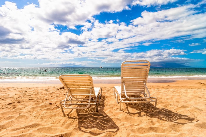 Beach with two sunloungers and the sea