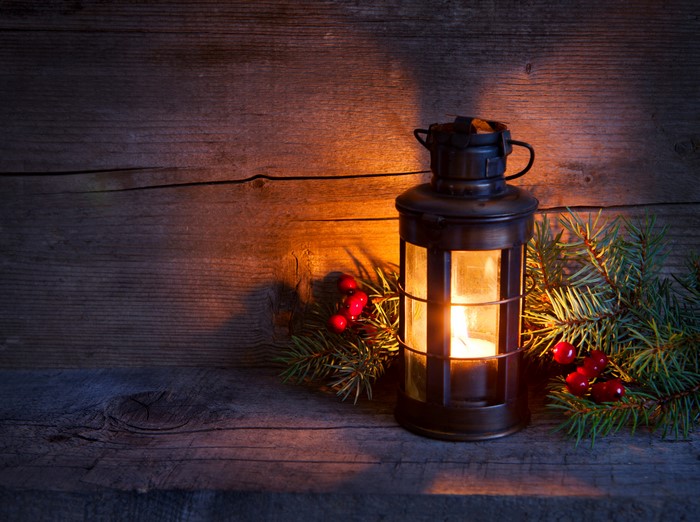 Christmas lantern with pine branches and berries