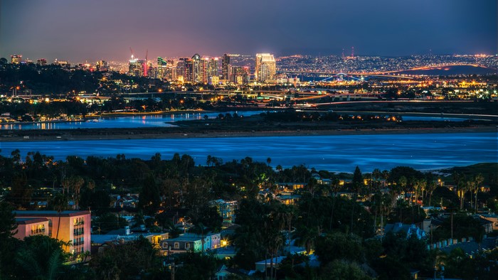 San Diego skyline at night with bay and houses