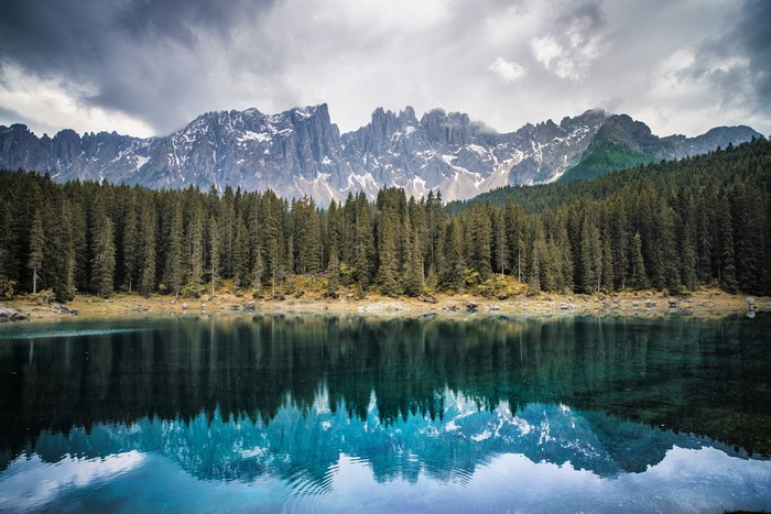 Lake Carezza with Mountains and Forest in Italy