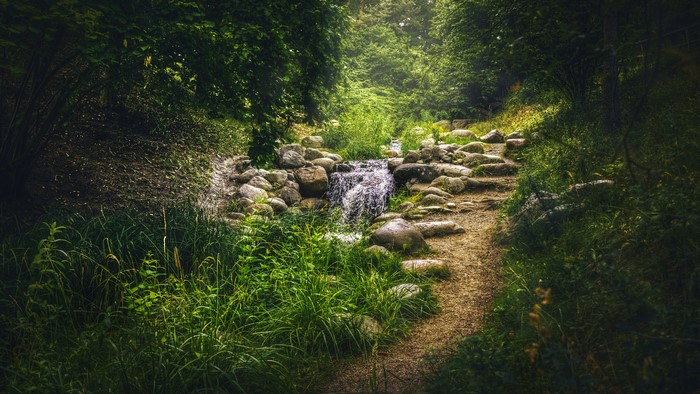 Stream flowing over rocks in Britzer Garten, Berlin