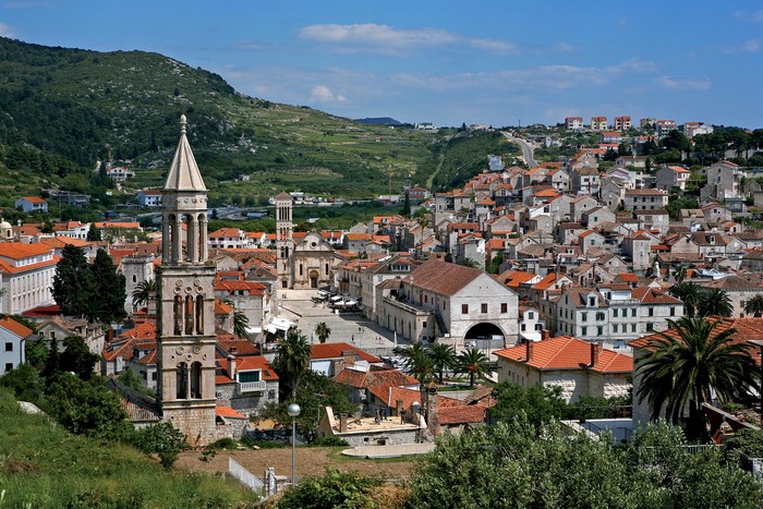Hvar, Croatia town with bell tower and green hills