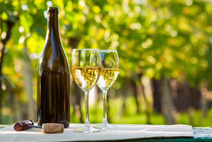 Bottle of Wine with Two Glasses and Corkscrew