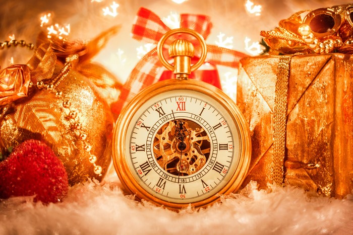 Pocket watch with Christmas gifts and decorations