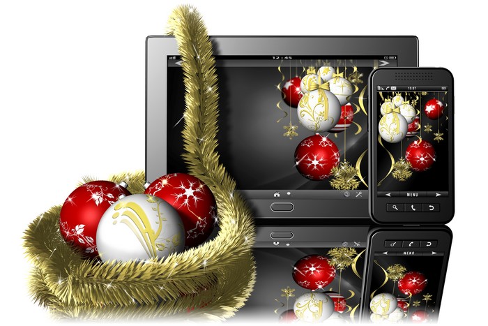 Christmas ornaments and tinsel on electronic devices