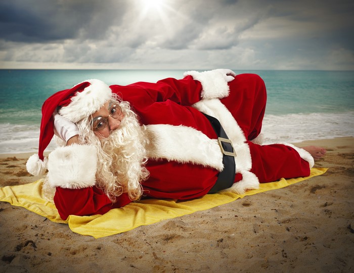 Santa Claus relaxing on a beach