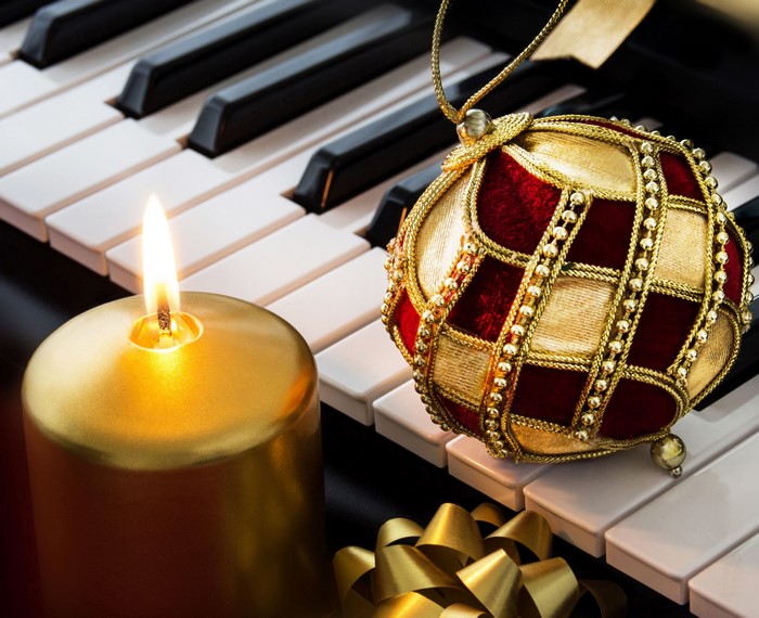 Christmas Ornament and Candle on Piano