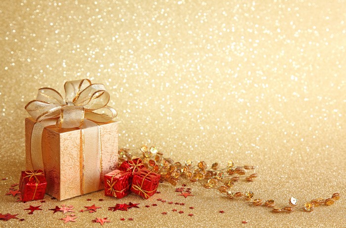 Gold and red gift boxes with glitter background