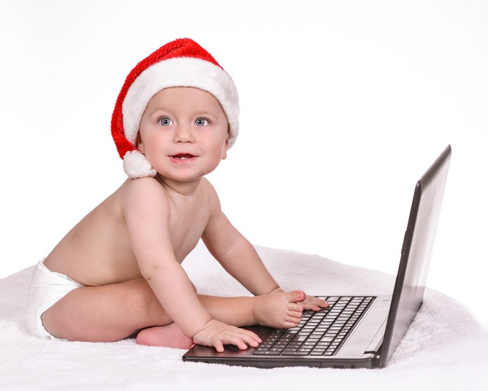 Baby in Santa Hat with Laptop
