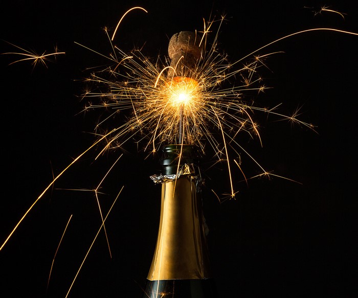Champagne bottle with sparklers and cork