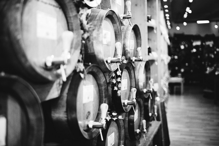 Wooden barrels with taps in a cellar