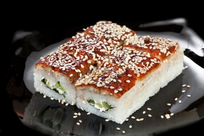 Sushi with eel and sesame seeds