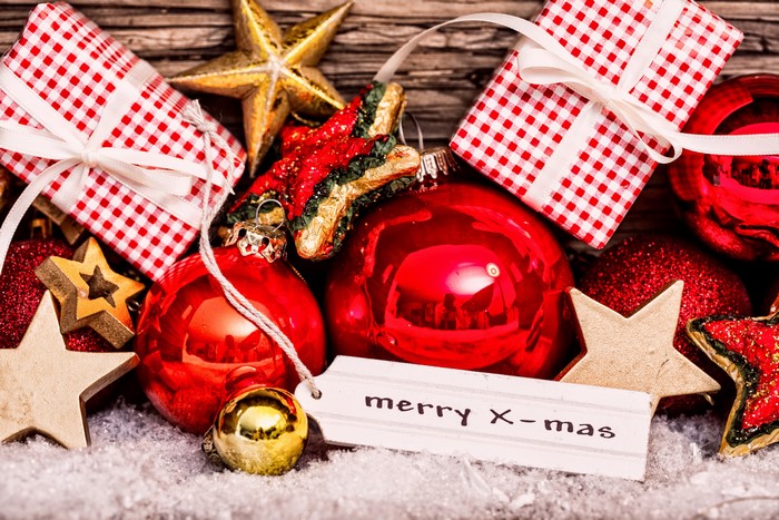 Christmas ornaments and gifts on snow