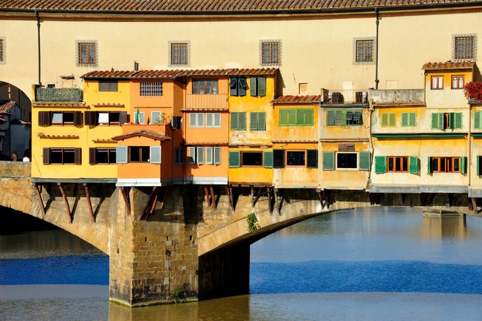 Ponte Vecchio bridge with colorful houses over the Arno River in Florence, Italy