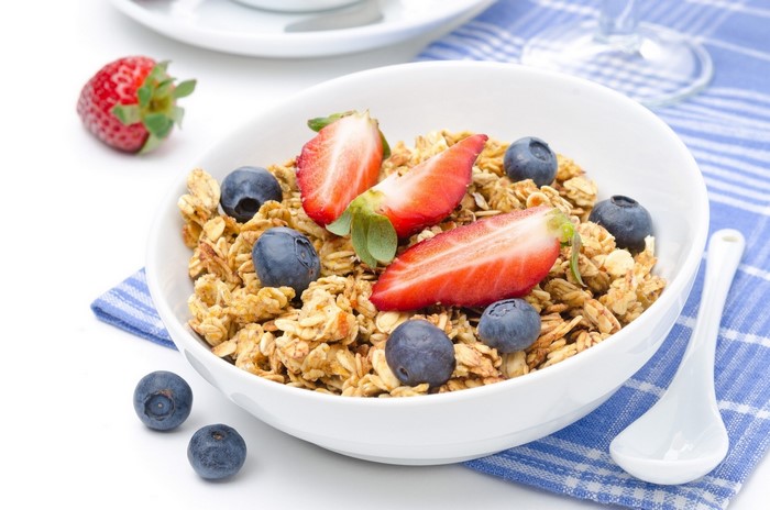 Bowl of granola with strawberries and blueberries