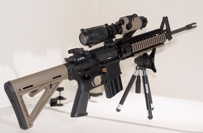 AR-15 rifle with scope on tripod