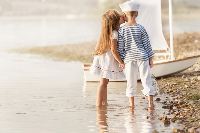 Two children by a boat