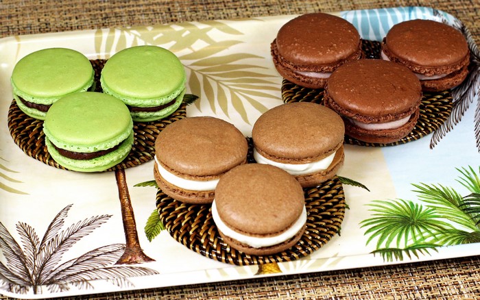 Green and brown macarons on a tray