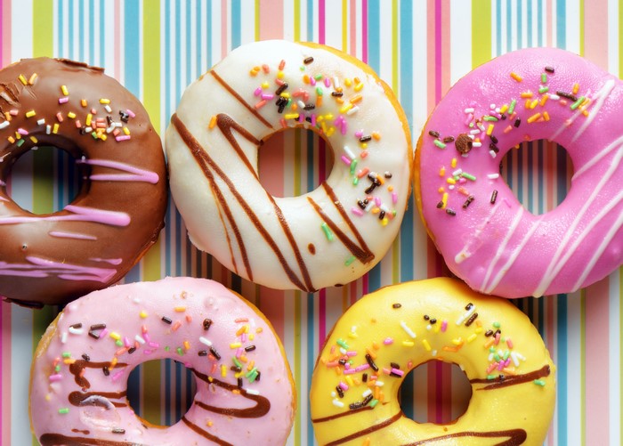 Assortment of colorful donuts with sprinkles