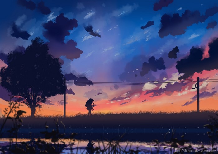 Couple walking at sunset with reflection