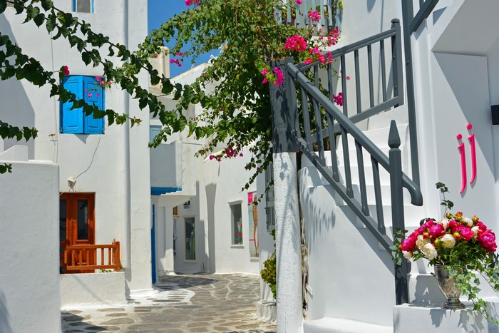 White houses with blue shutters and stairs in Greece