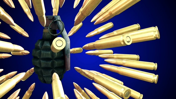Hand grenade surrounded by bullets