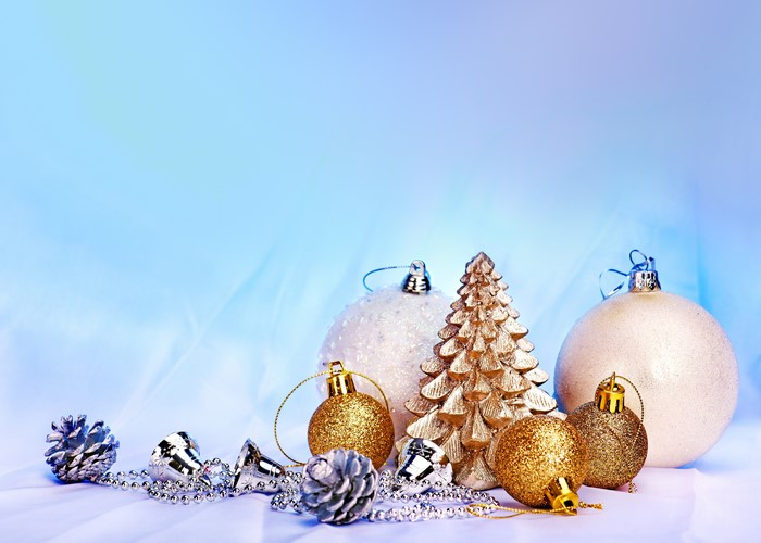 Christmas ornaments and pine cones on a blue background