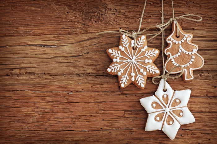 Christmas gingerbread cookies on wooden background