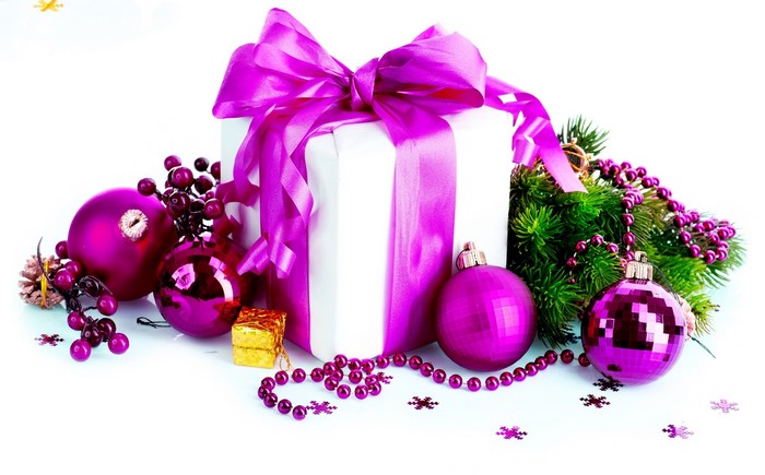 Christmas gift with purple ornaments and pine branches