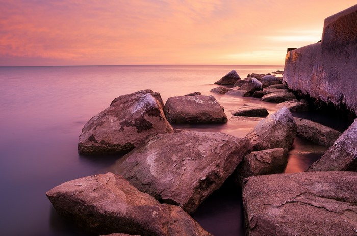 Lake Michigan coast with rocks at sunset