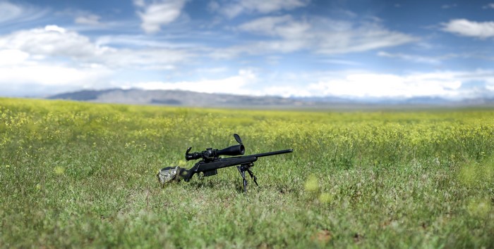 Tikka T3 sniper rifle in a field