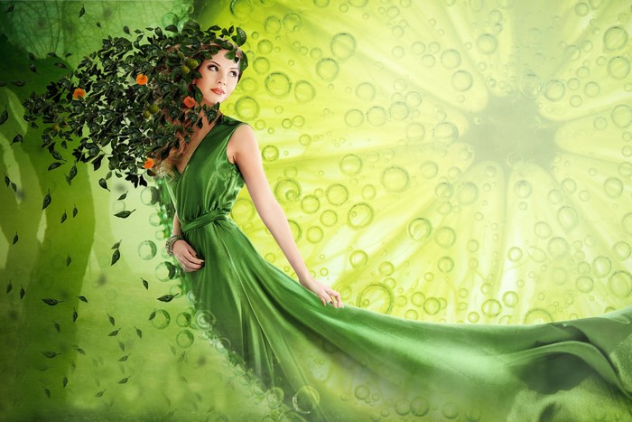 Woman with foliage hair in a green dress against lime background