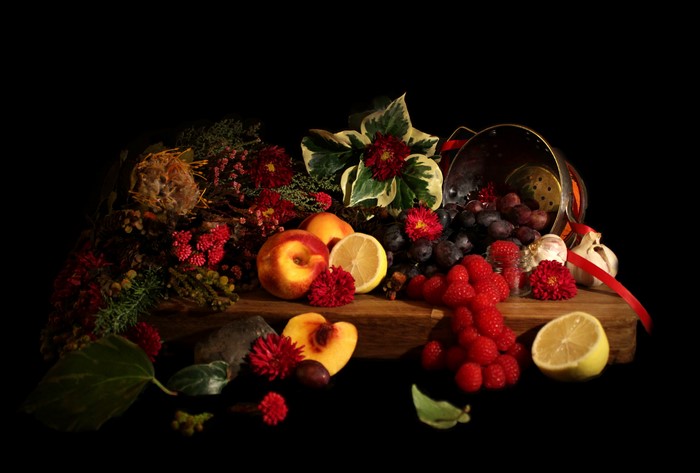 Still life with fruits, flowers, and garlic