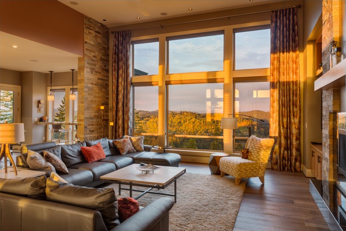 Living room with large windows and mountain view